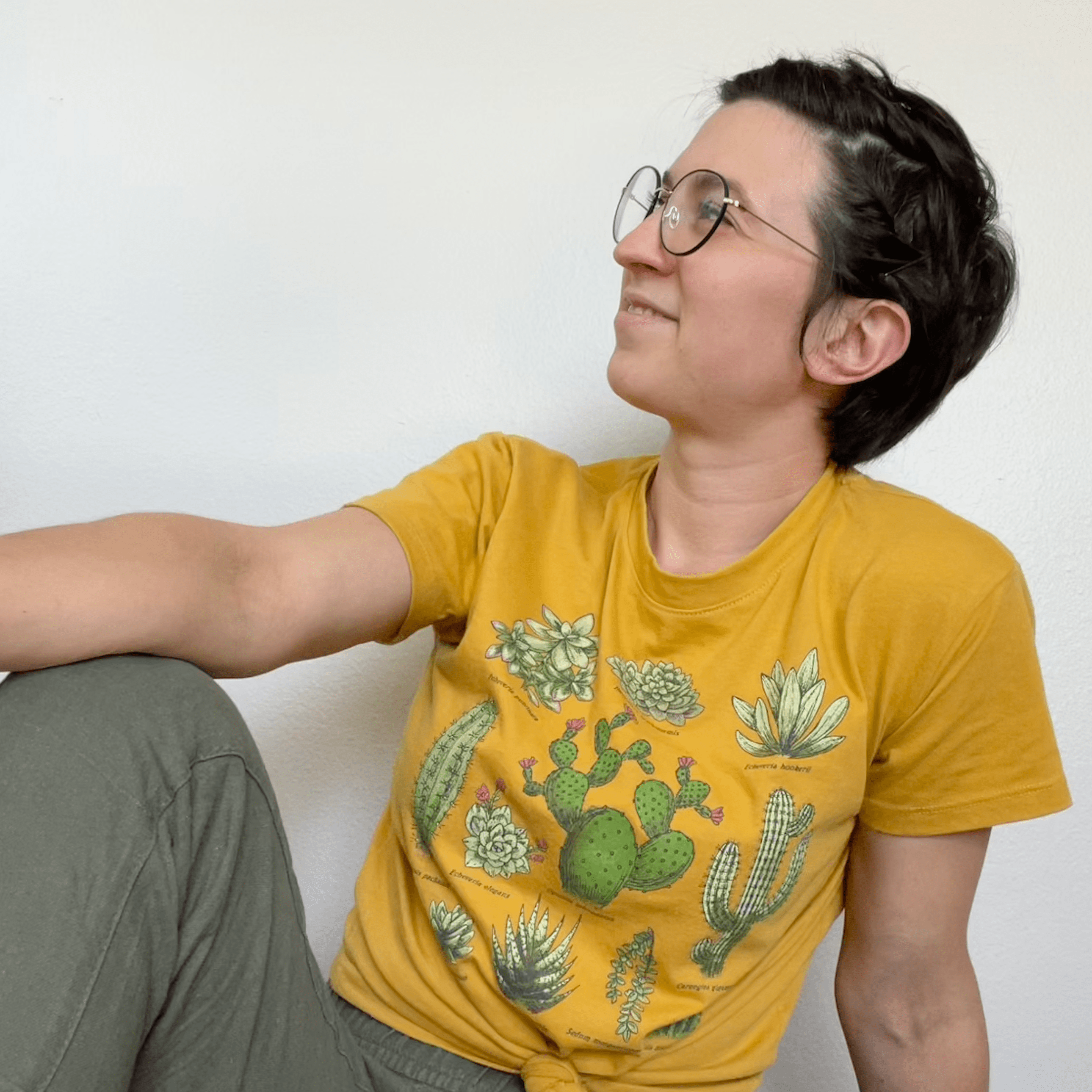 Image of Anna in a yellow shirt and green pants